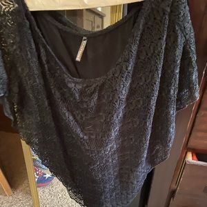 Lace on top, looks like an upside down triangle with a sold black tank under it